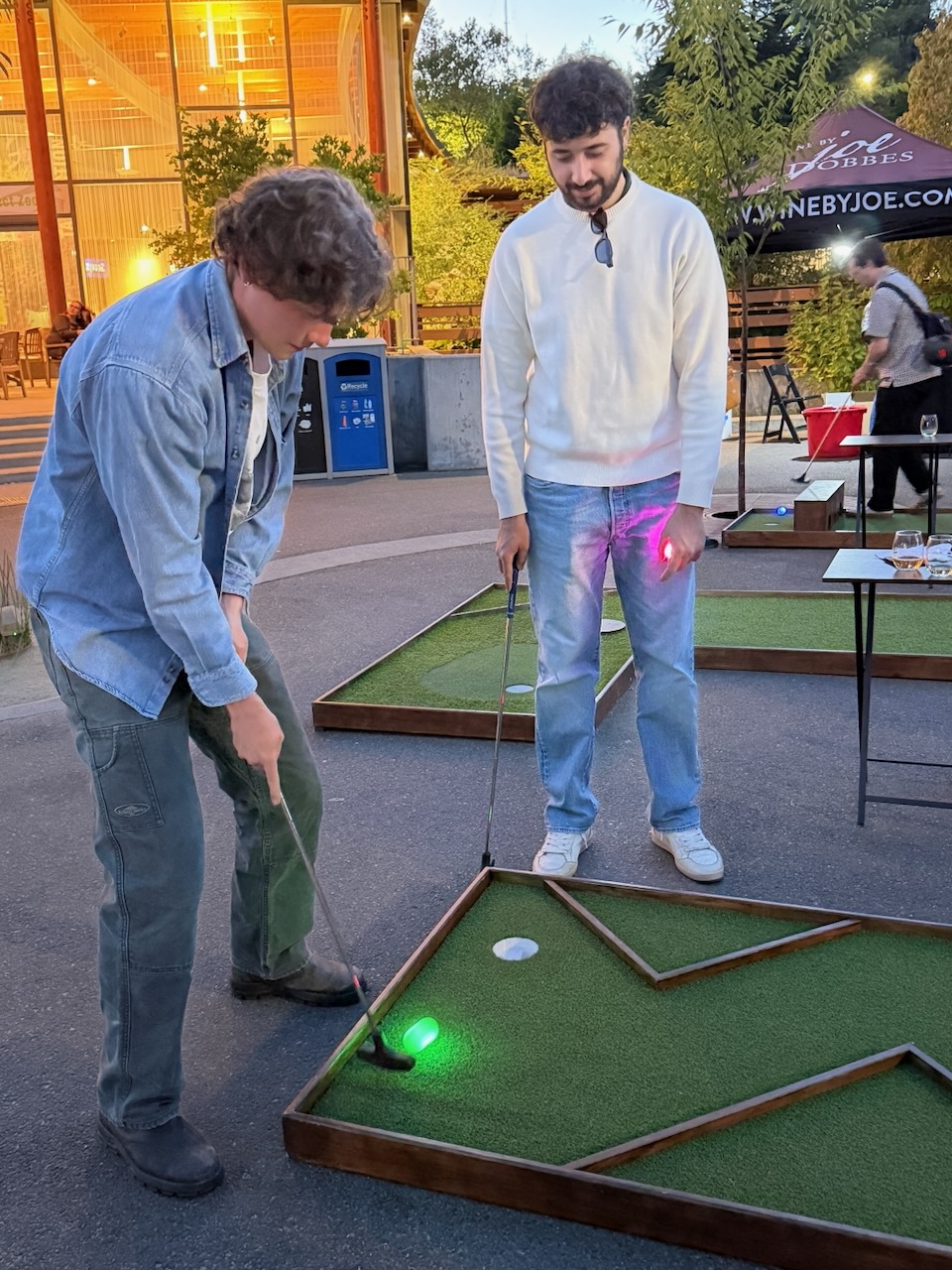 Guests playing mobile mini golf during Oregon Zoo Nights