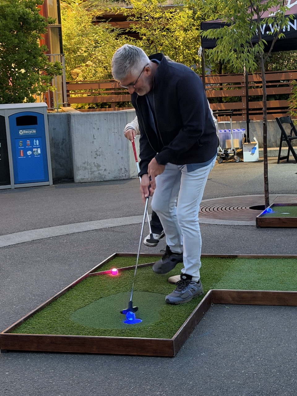 Guests playing mobile mini golf during Oregon Zoo Nights