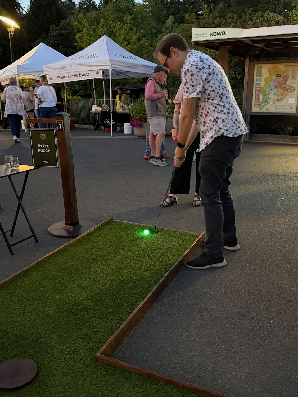 Guests playing mobile mini golf during Oregon Zoo Nights