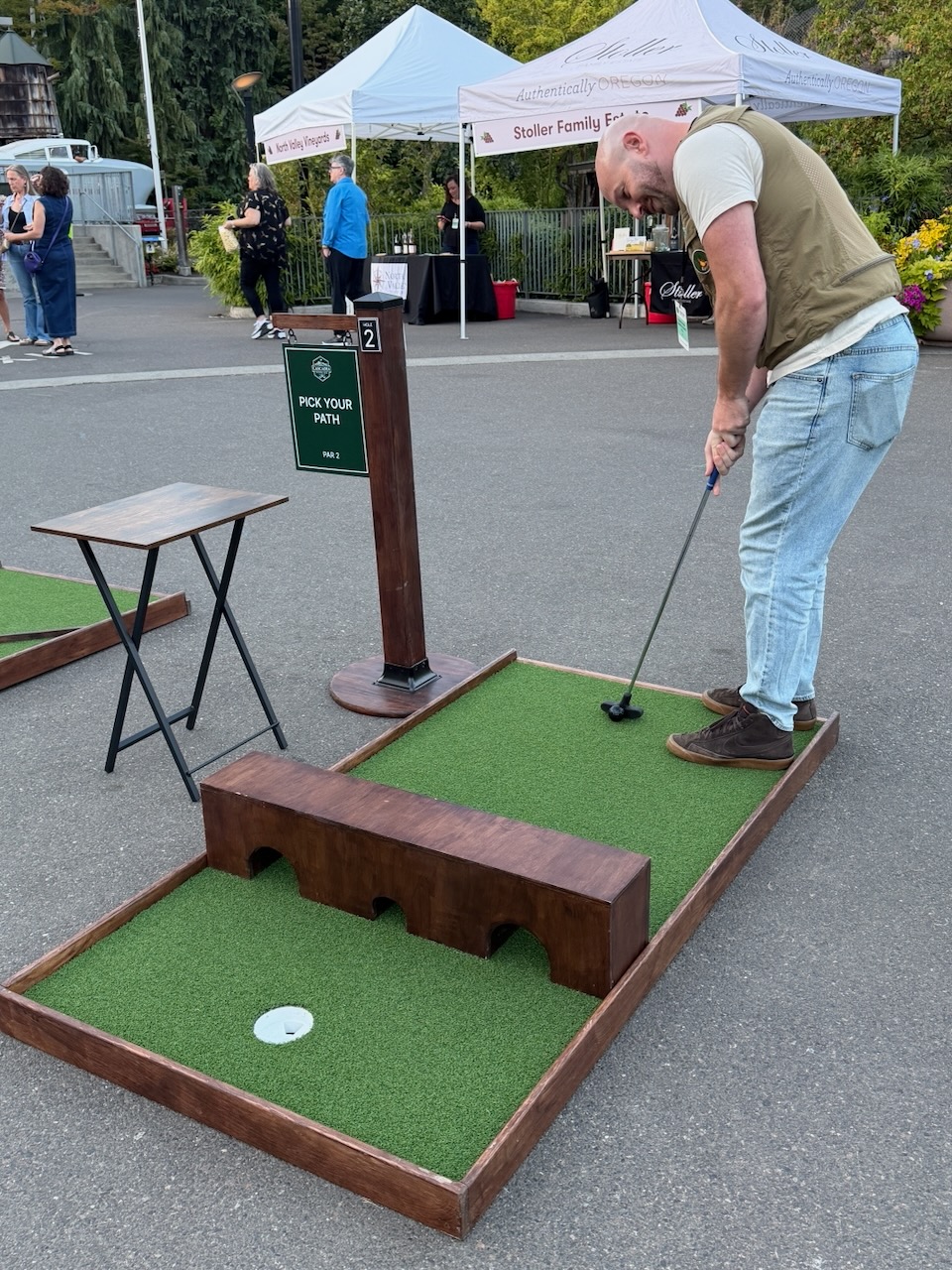 Guests playing mobile mini golf during Oregon Zoo Nights