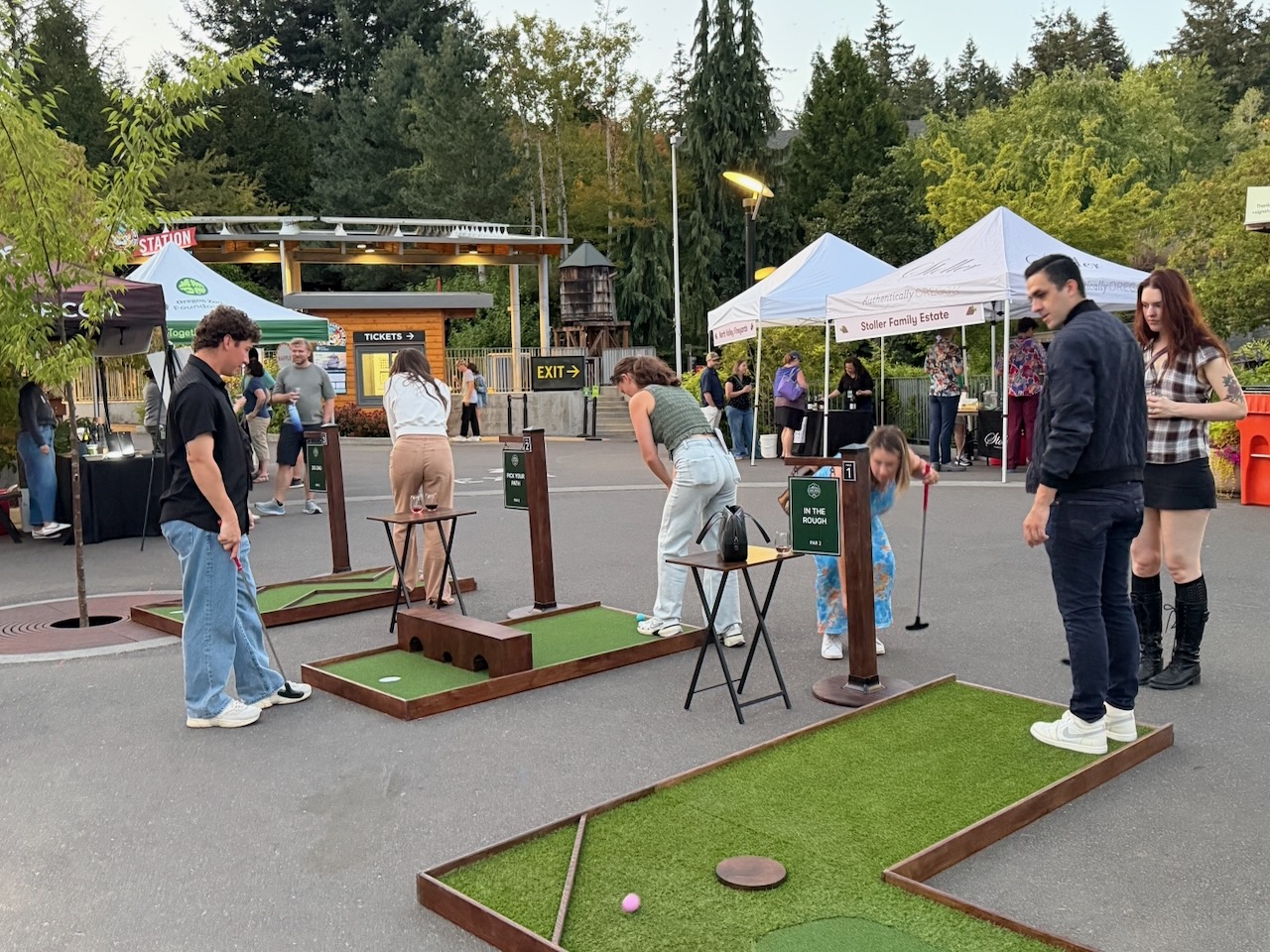 Guests playing mobile mini golf during Oregon Zoo Nights