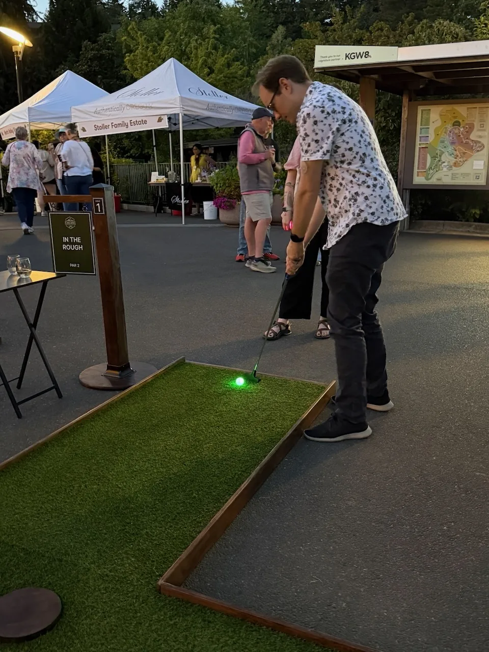 Guests playing mobile mini golf during Oregon Zoo Nights