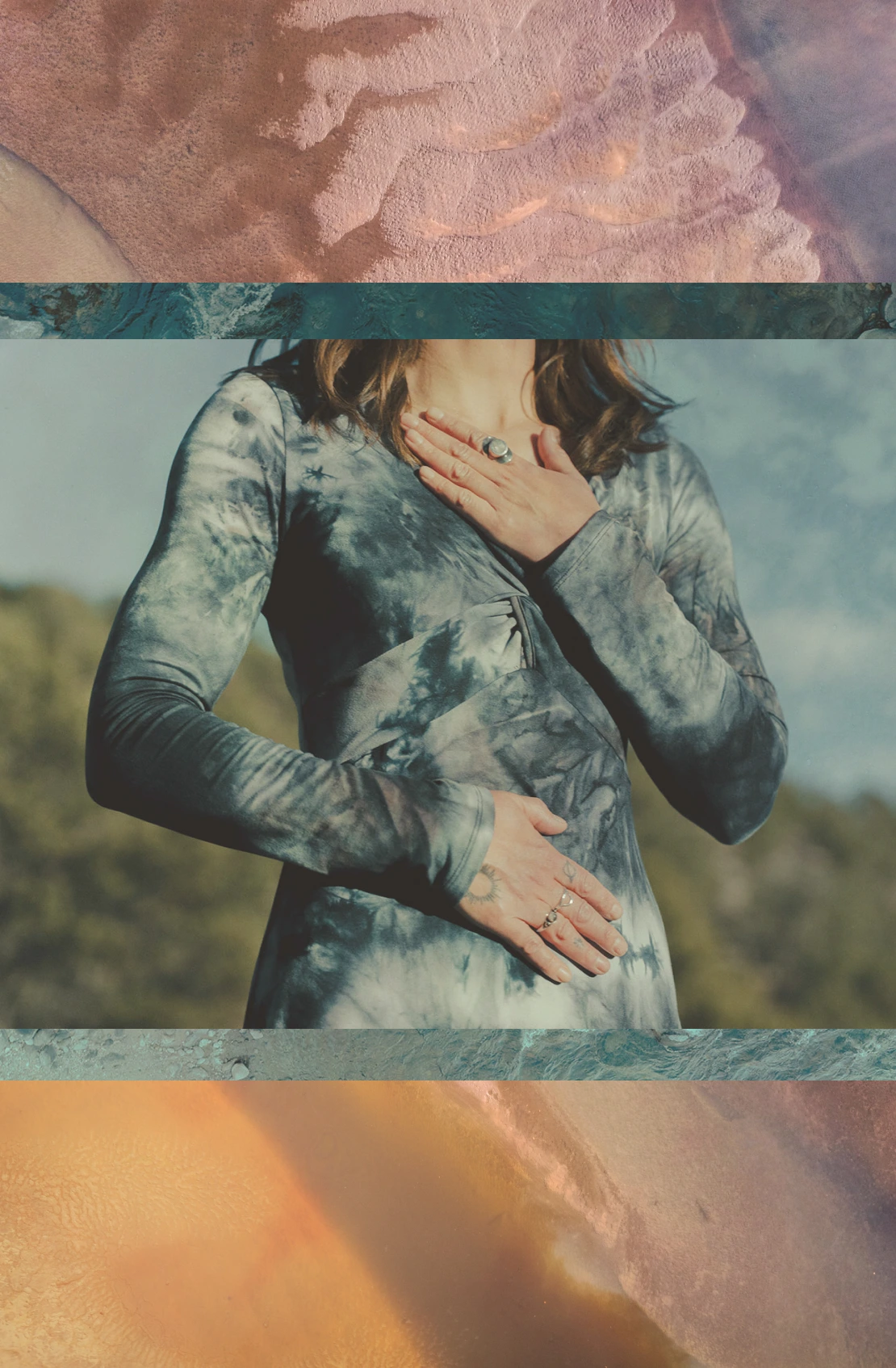 Person in a tie-dye long-sleeve shirt with hands on chest and stomach, bordered by textured aerial views of land and water.