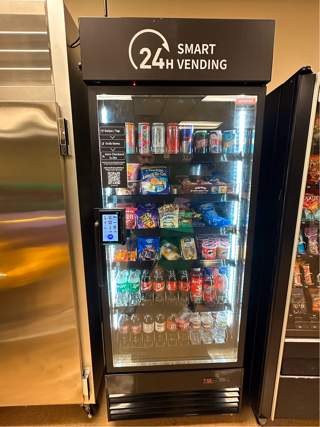 AI smart cooler vending unit stocked with healthy beverages and snacks