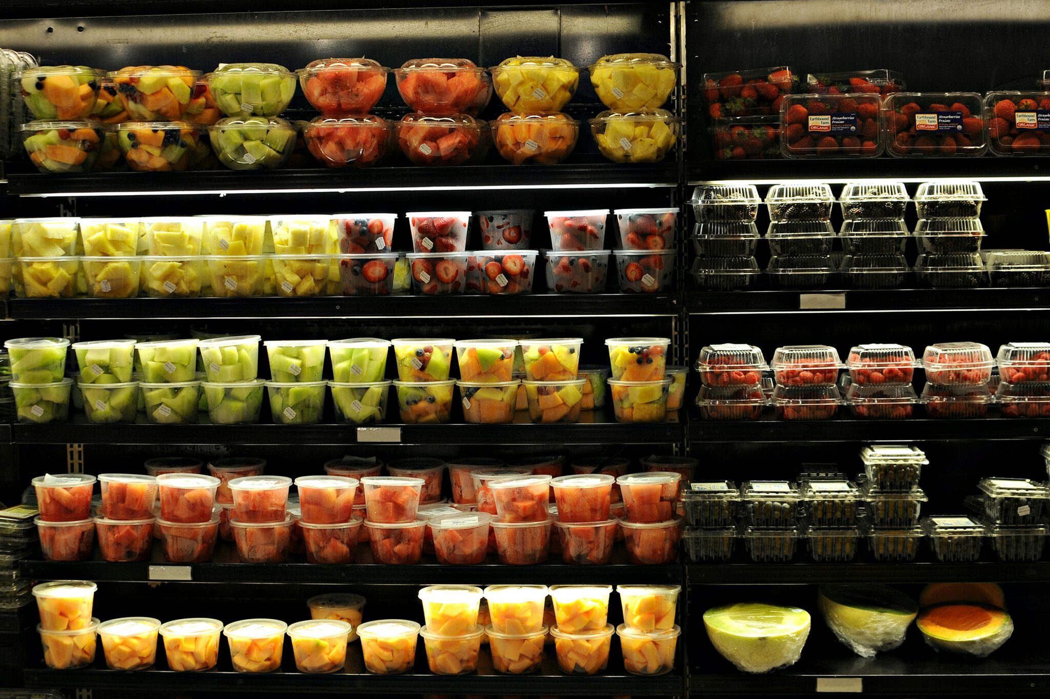 A store shelf including fresh cut fruit