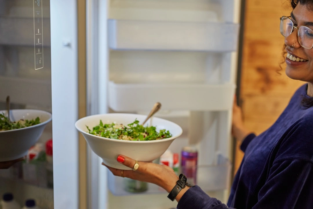 Employees selecting fresh salads and healthy meals in a micro market Employees selecting fresh salads and healthy meals in a micro market