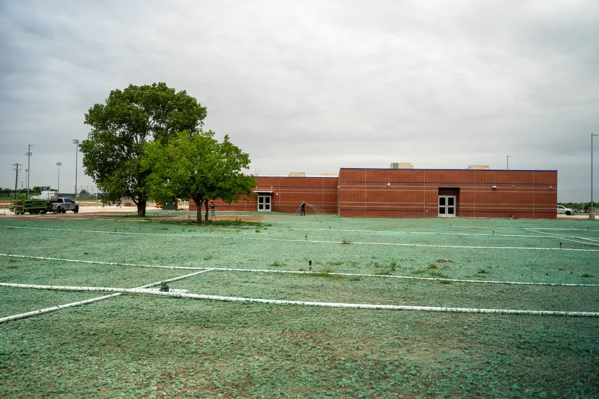 Commercial hydroseeding results at a North Texas brick building property
