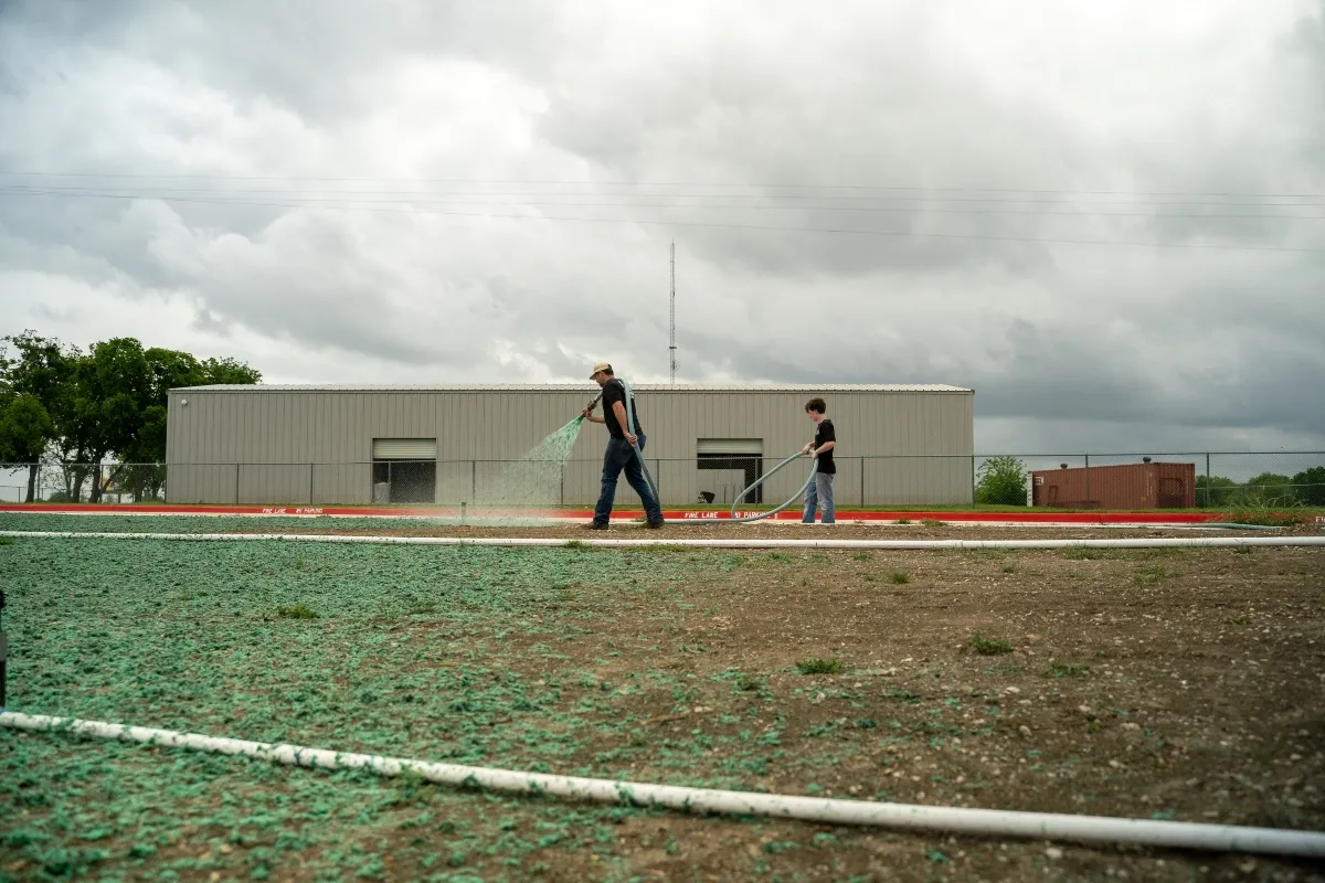 Hydroseeding crew working on large commercial lot in North Texas