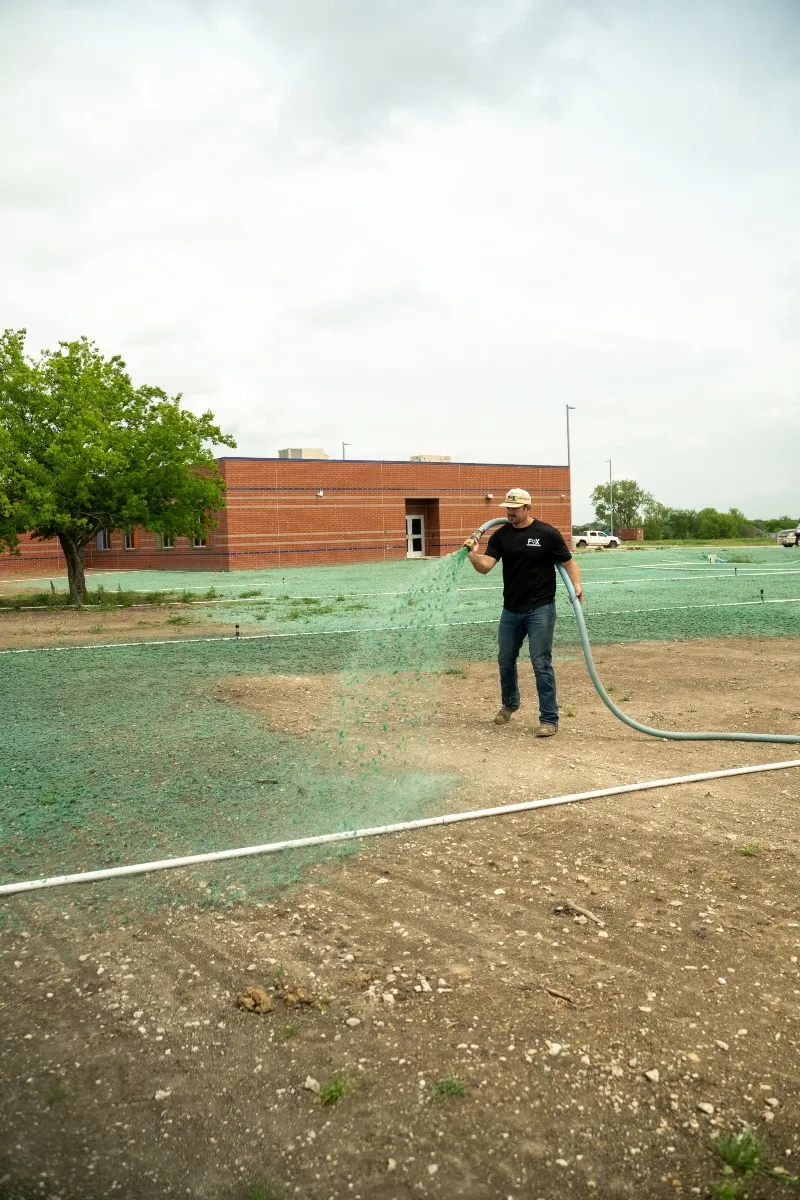 Hydroseeding application on commercial property in North Texas