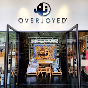 Entrance of Overjoyed art and craft store with glass doors open.