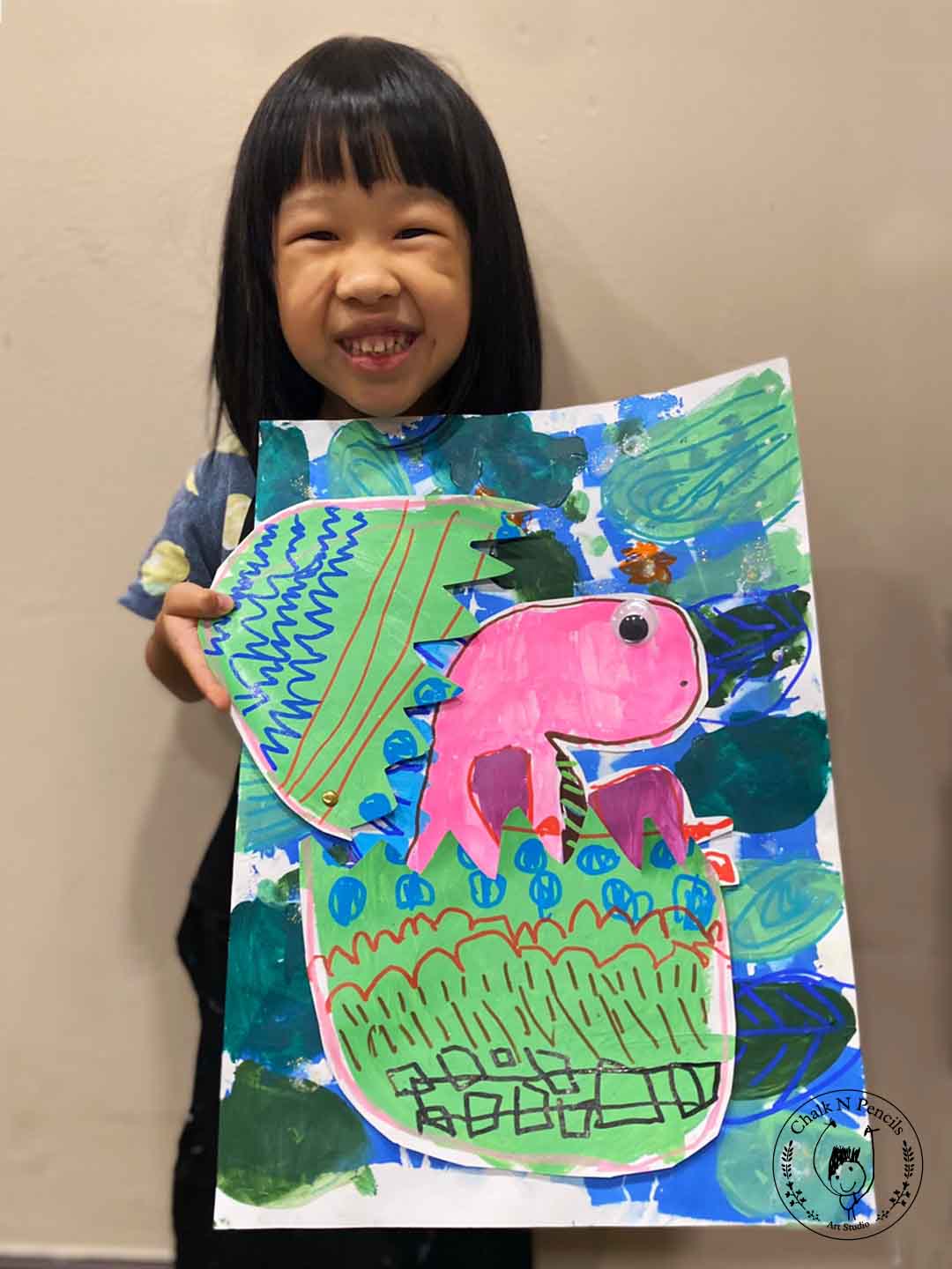 Child mixed-media collage showing clear symbols