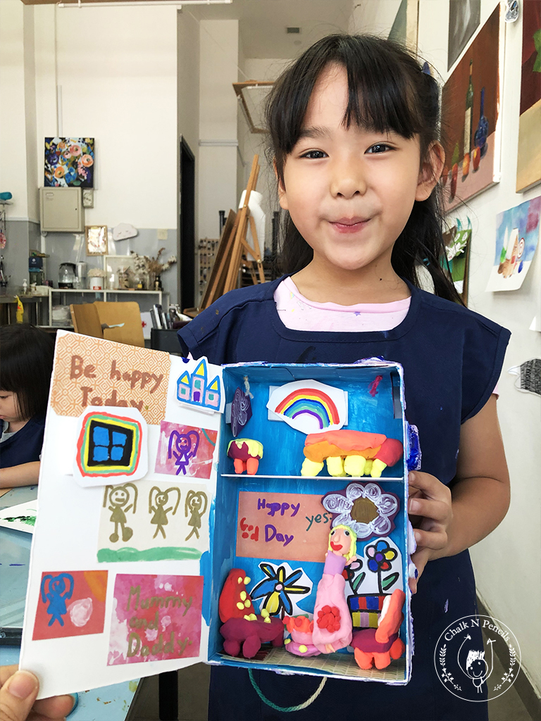 Child working on an expressive mixed-media artwork