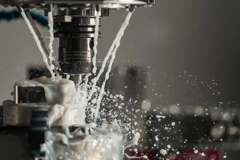 CNC cutter machining metal with coolant