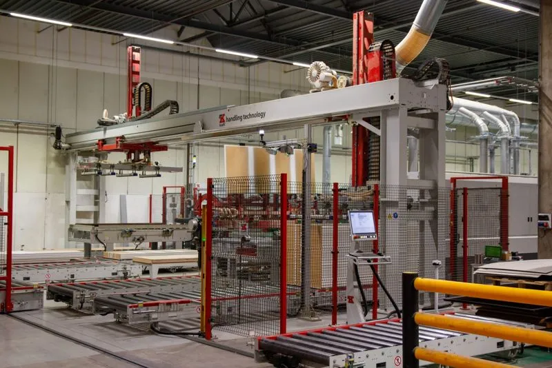 Robot arm working inside industrial machinery