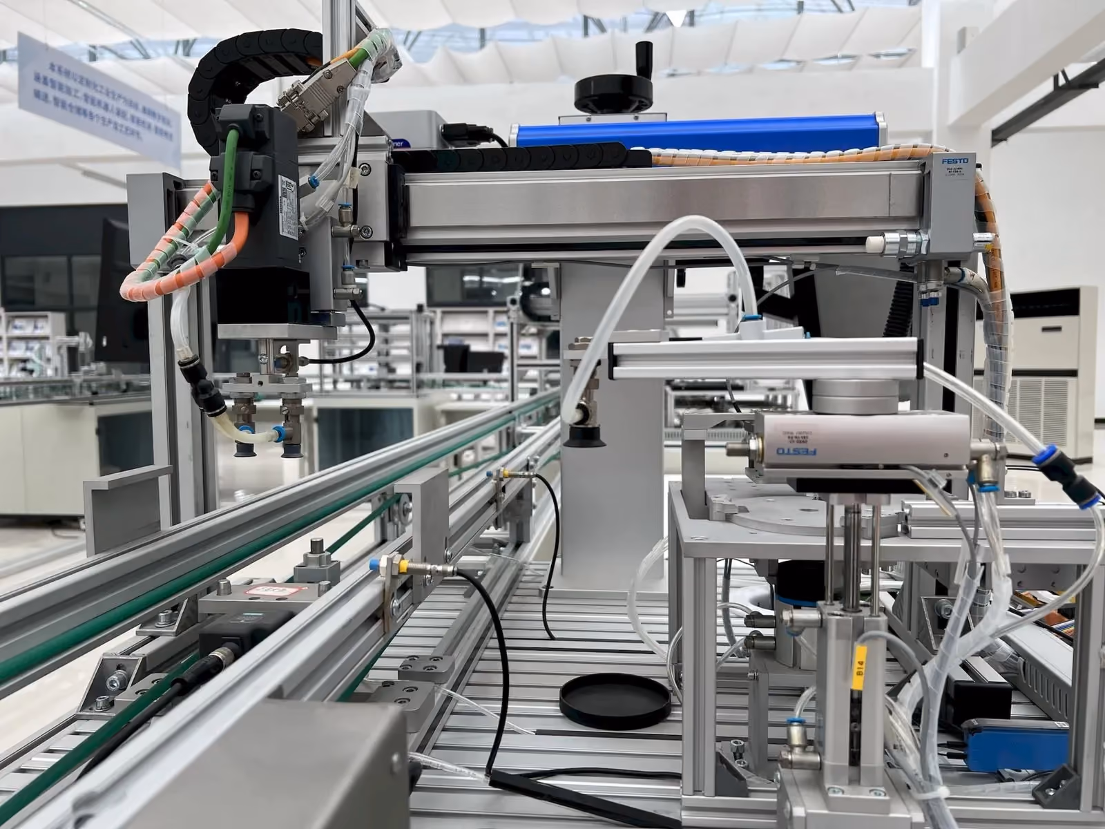 Automated handling machinery moving parts along a production line