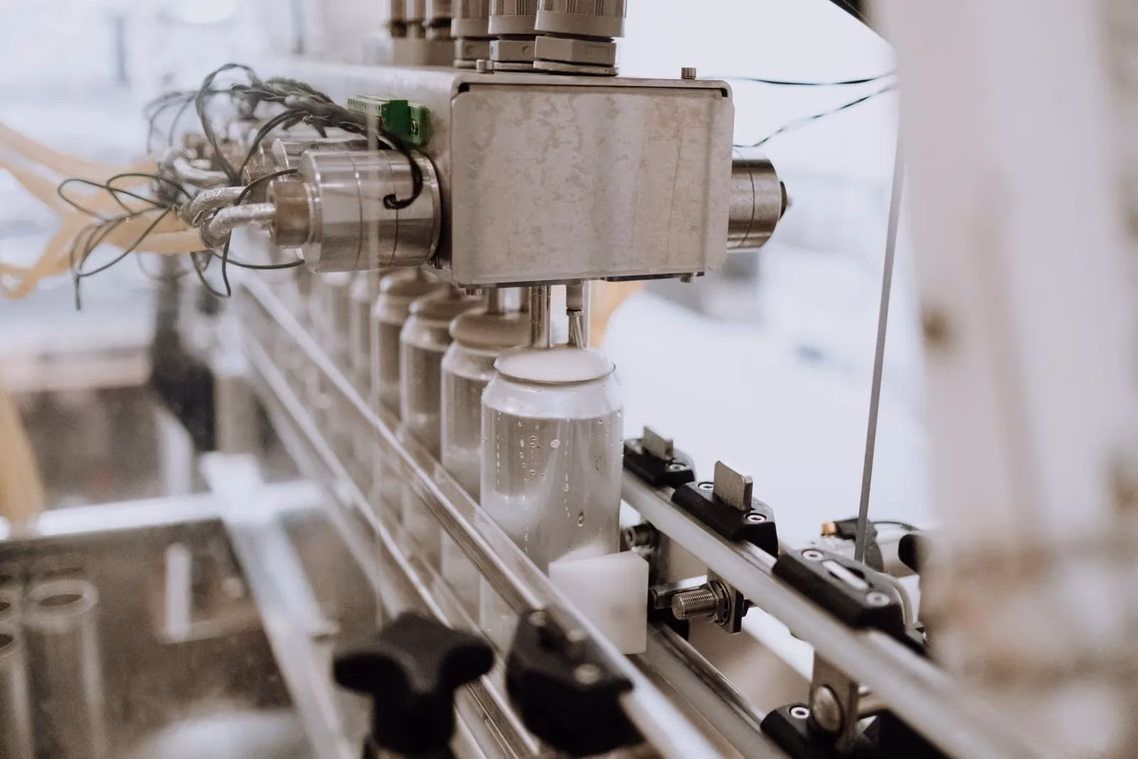 Automated filling line moving containers through a beverage plant