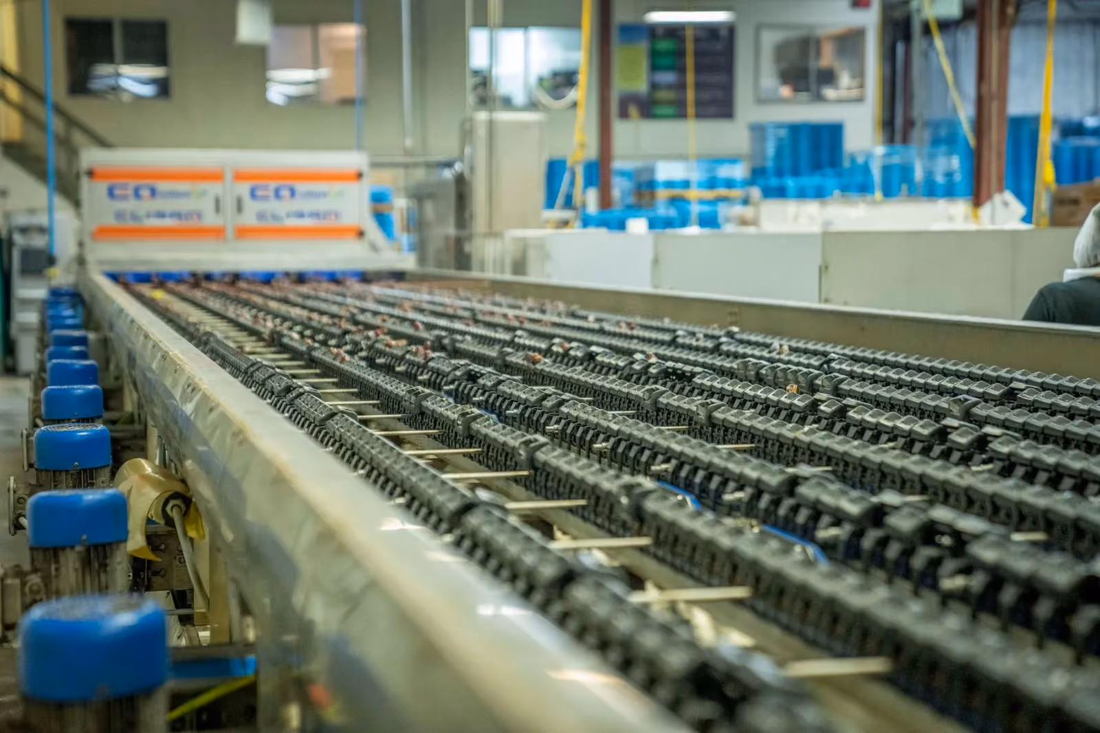 Industrial roller conveyor running the length of a production hall
