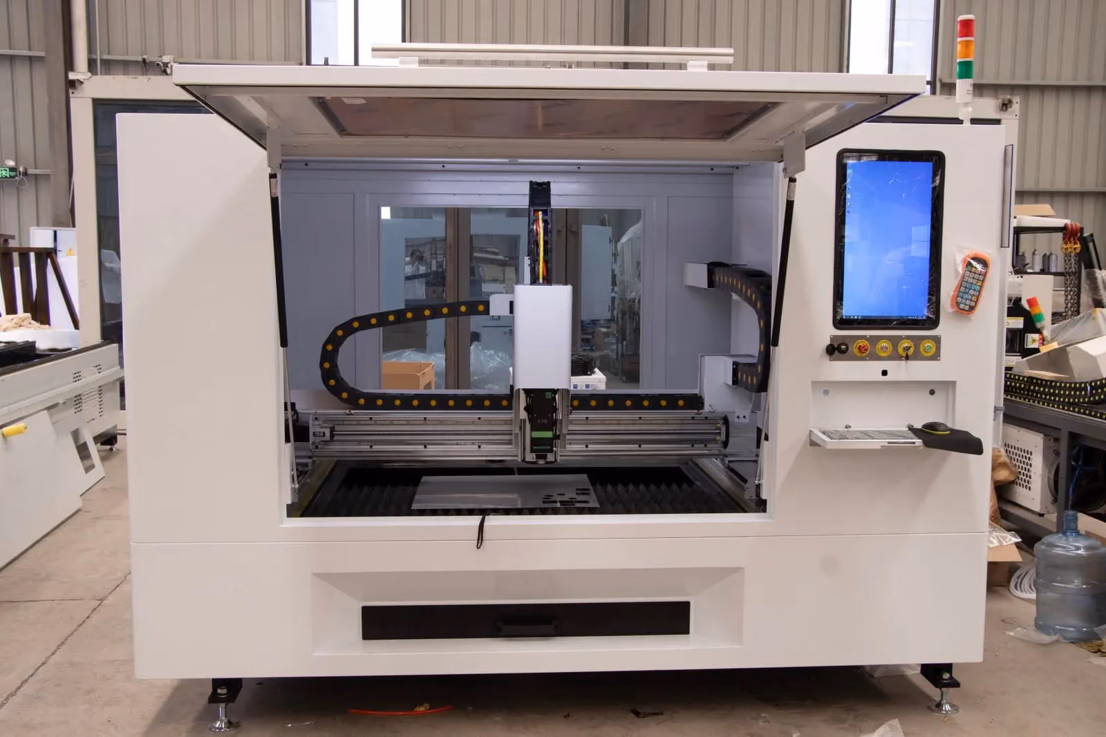 Front view of a CNC machining centre standing on a factory floor