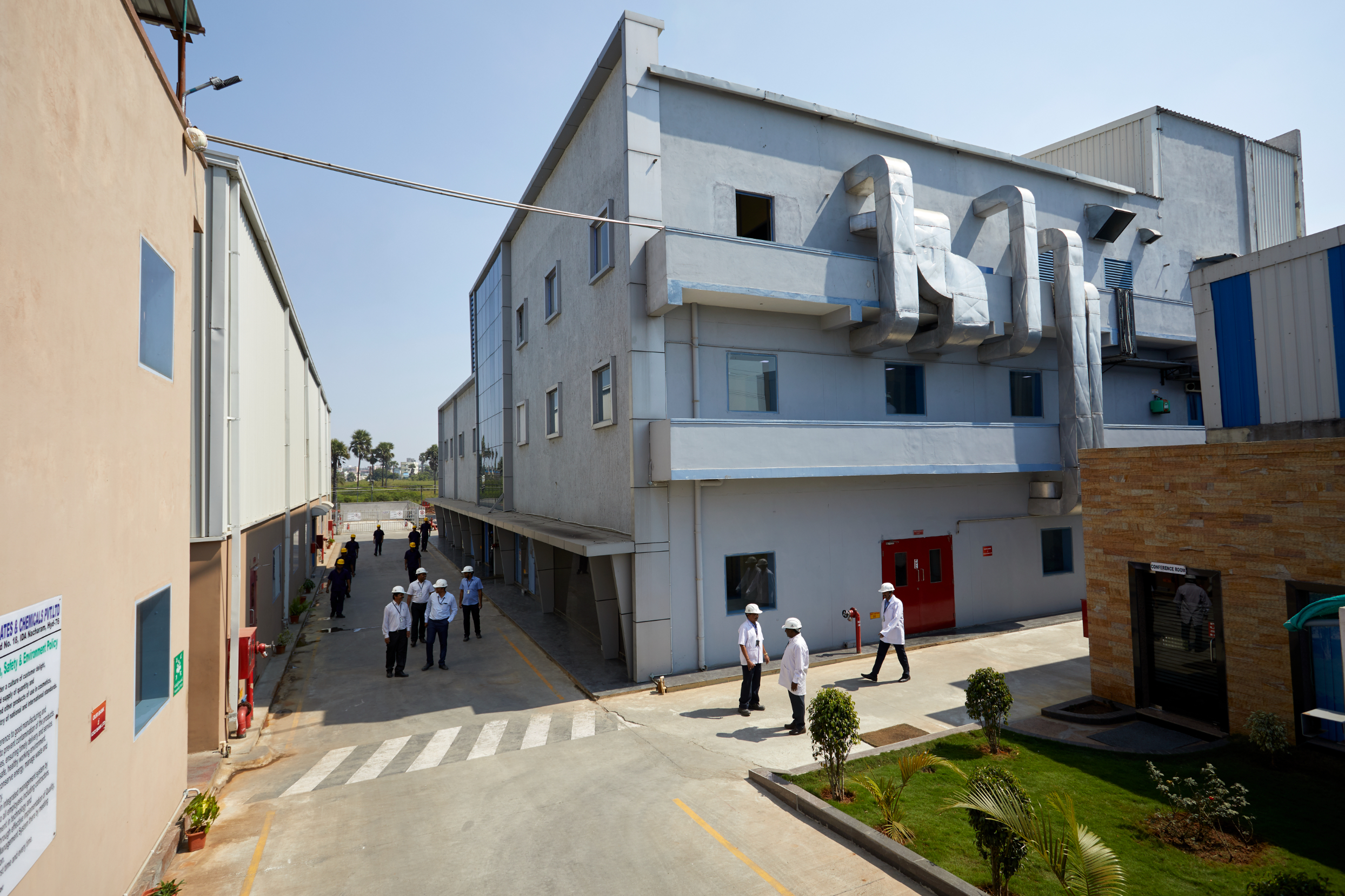 Modern chemical manufacturing campus with production buildings and safety-focused operations.