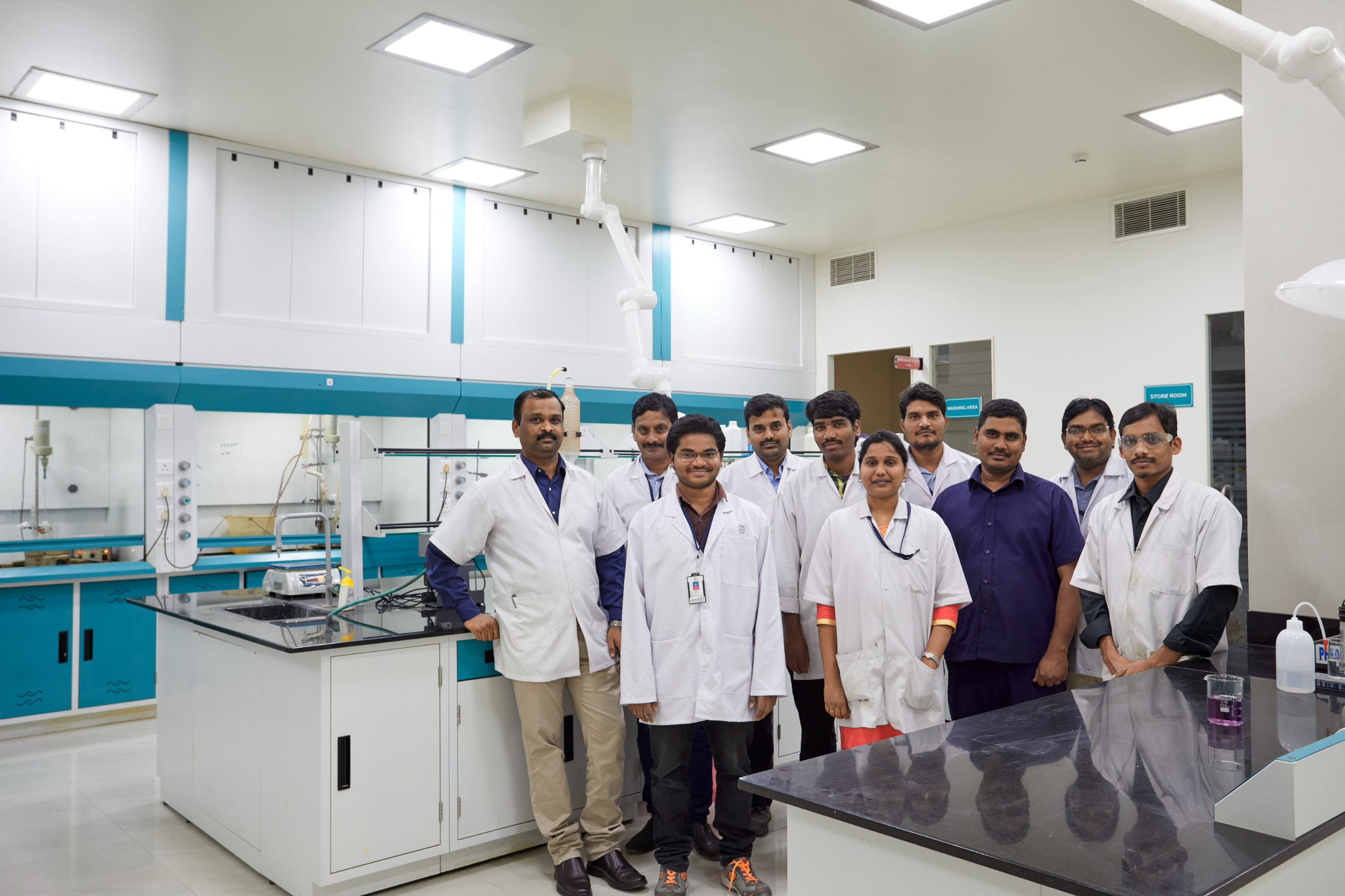 Research and development team in a modern analytical chemistry laboratory.