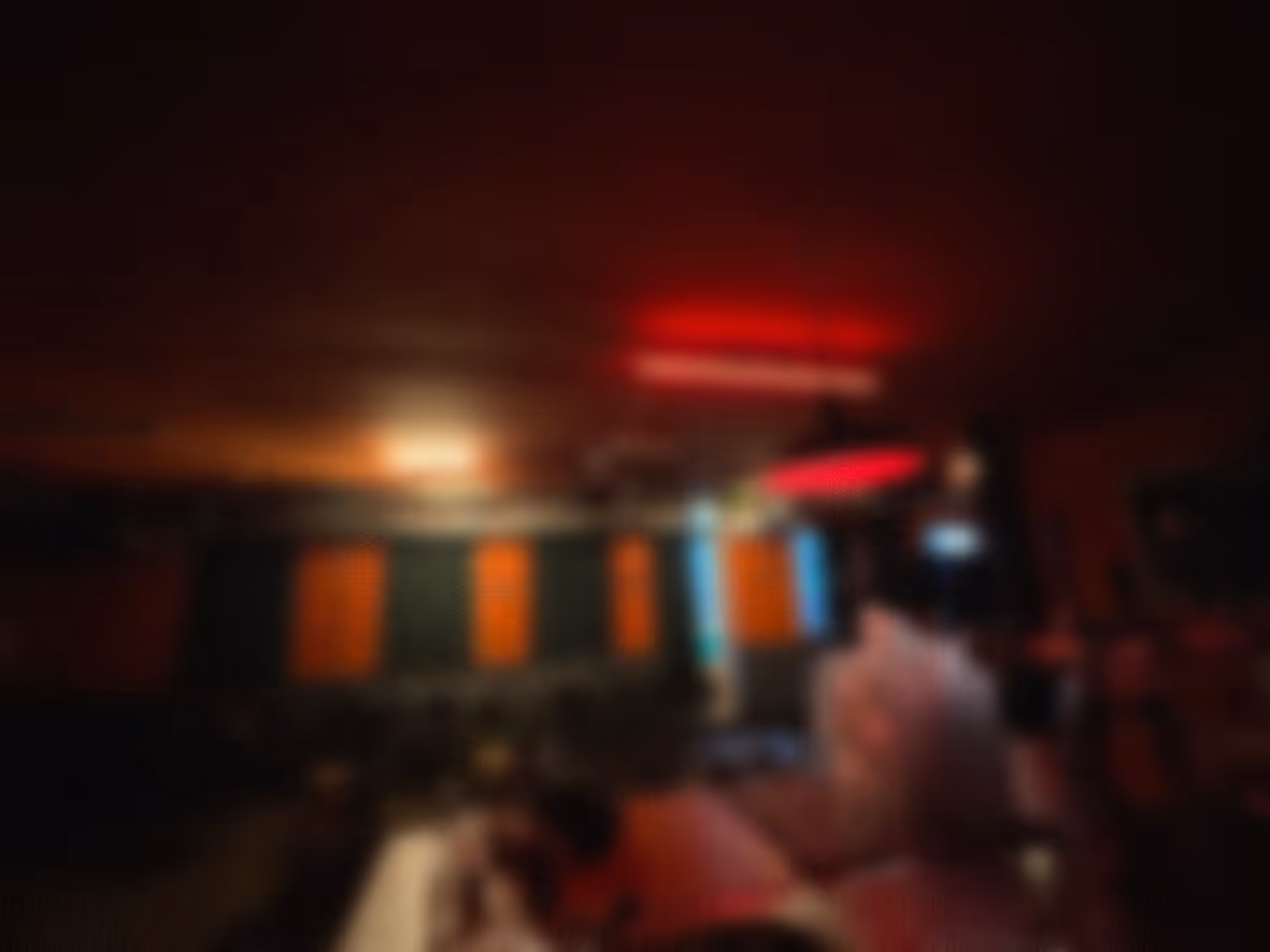 Alt: Interior of an Amsterdam venue during a busy nightlife event