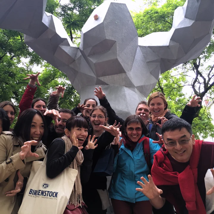 A large group of students posing in front of "Le Monstre" in the Place du Grand Marché in Tours, France.
