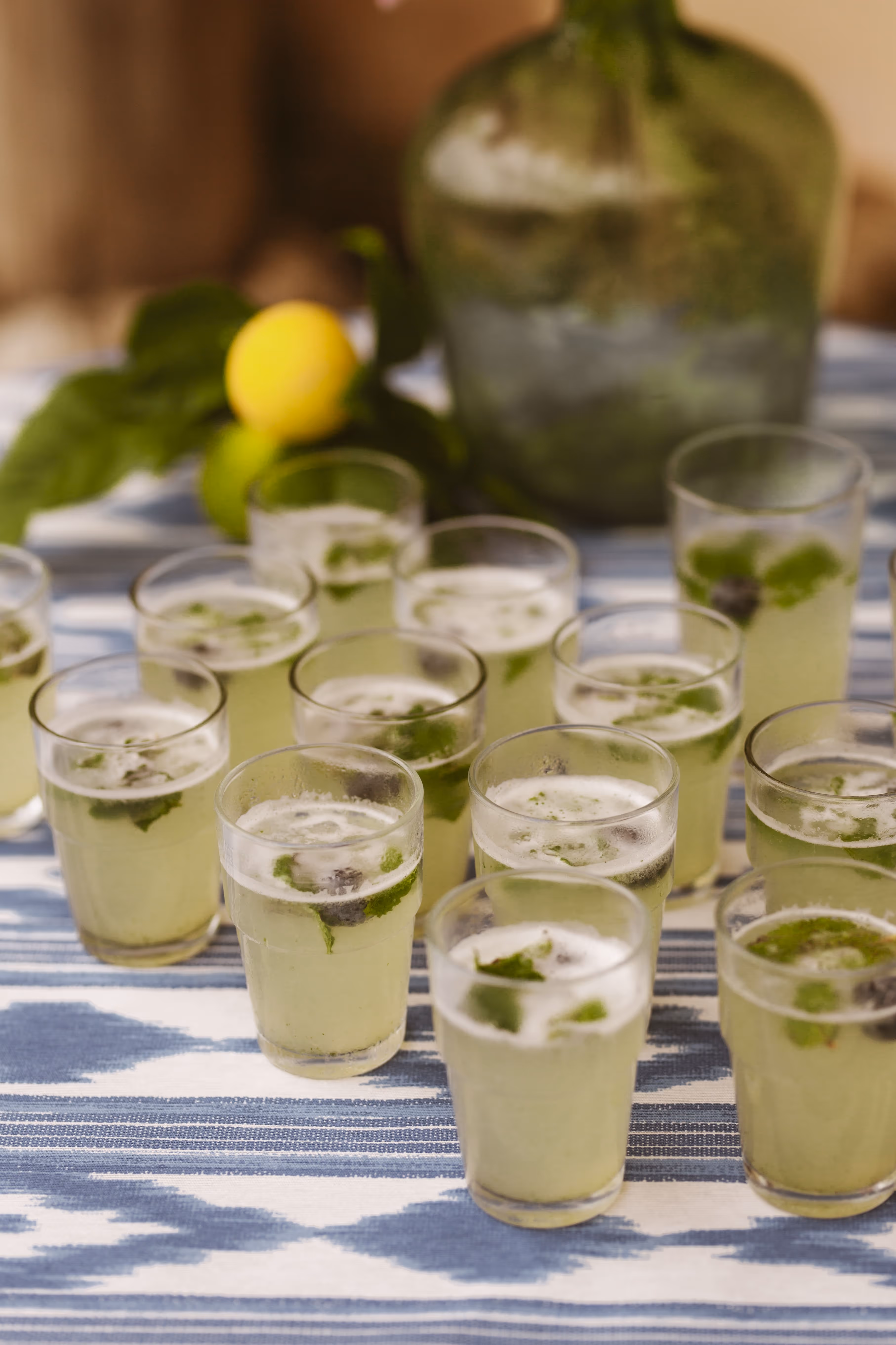 Glasses of homemade lemonade on a rustic table at the retreat center Finca Higo.