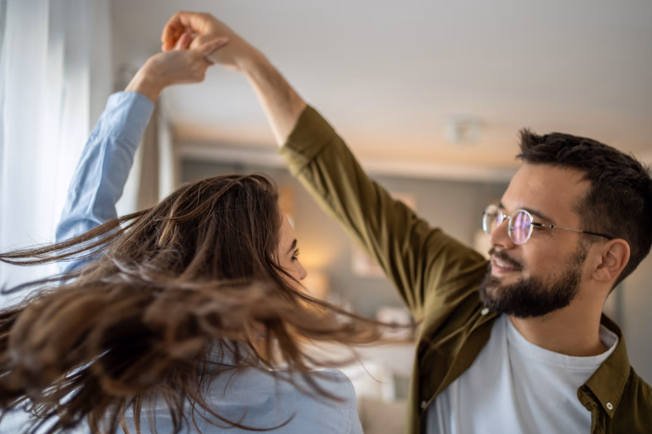 Couple dancing with healthy hair