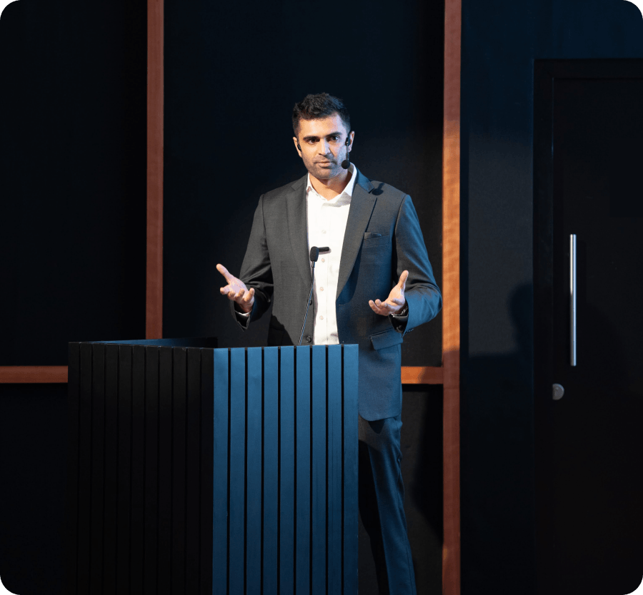 Speaker presenting at a podium