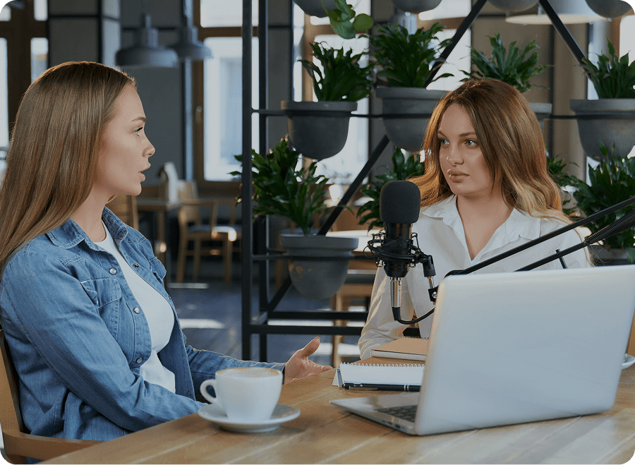 Two professionals having a conversation in a modern office