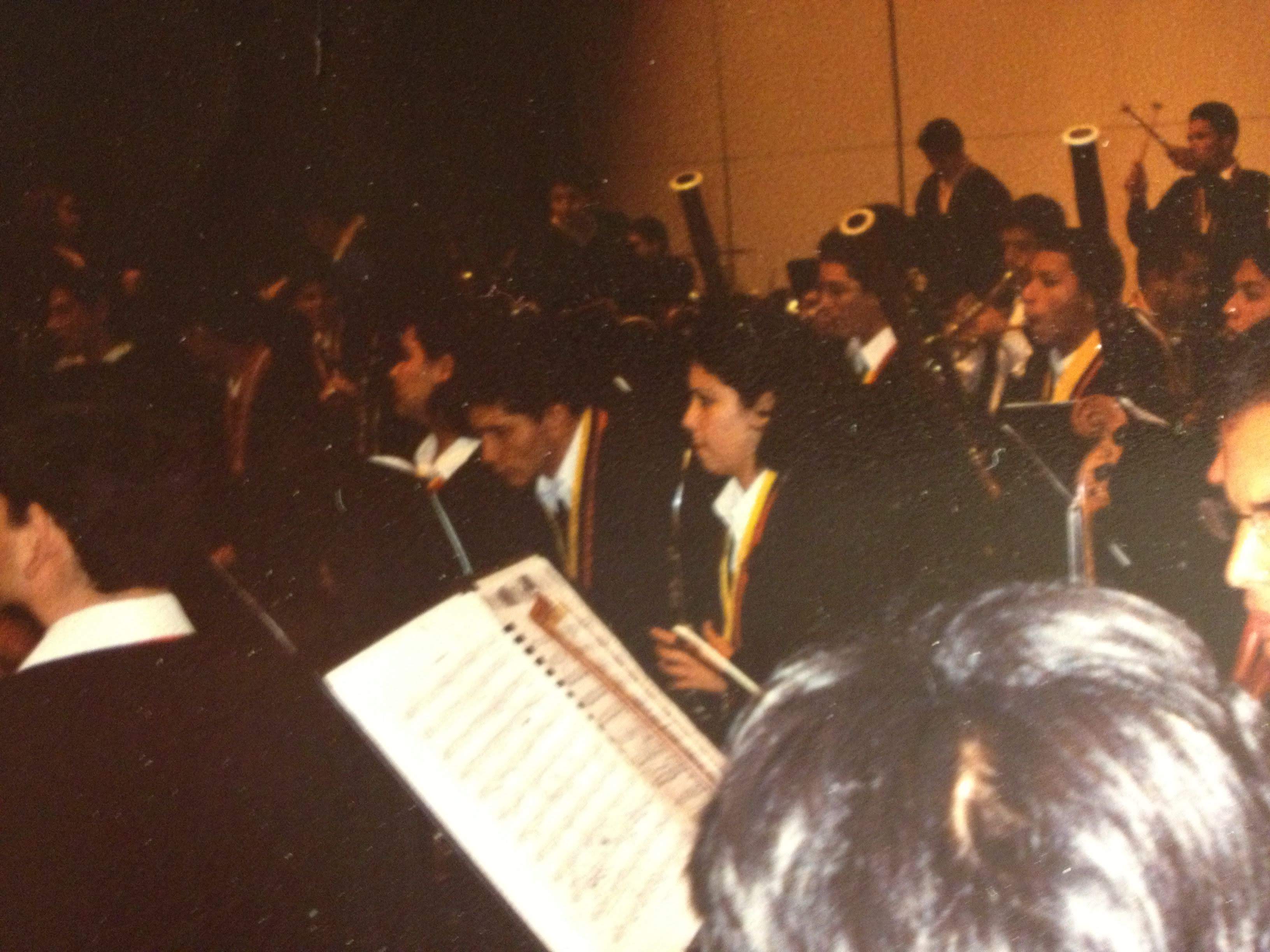 An archival photograph of musicians seated together in an orchestra.