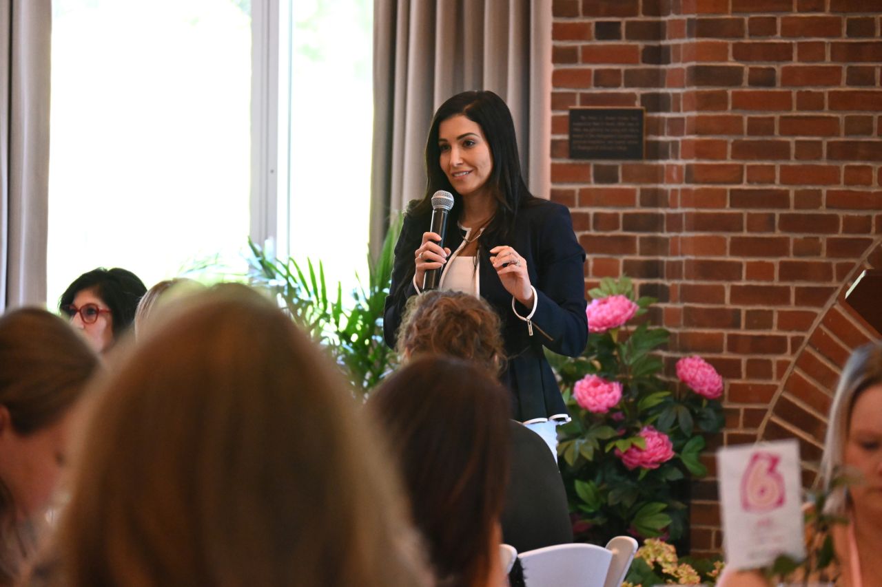 Nayli Russo speaking at the All For Her luncheon.