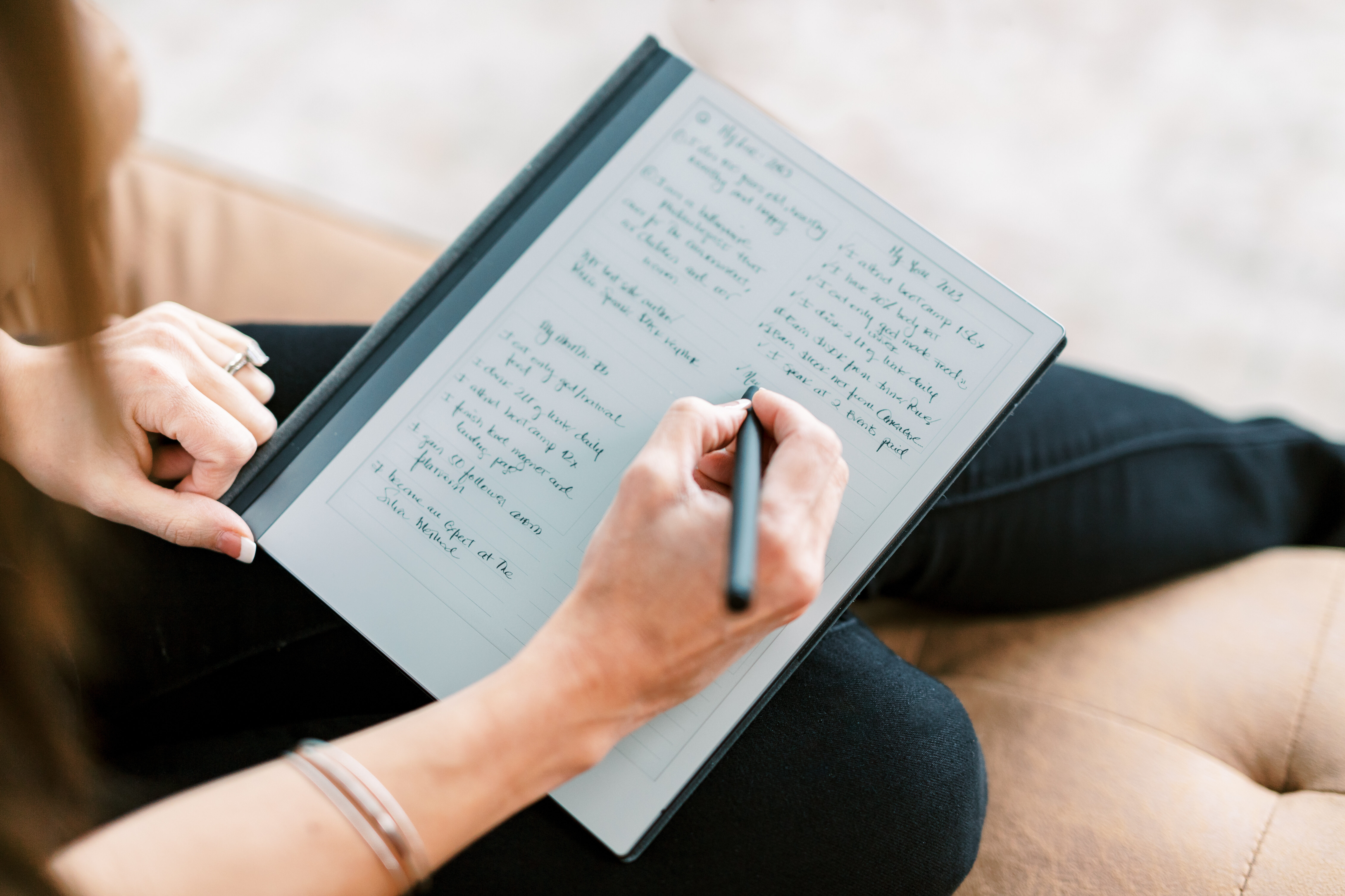 Nayli Russo writing notes by hand on a digital notebook.