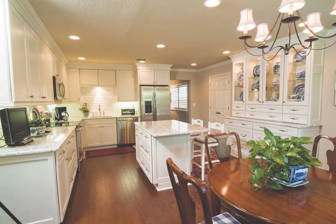 Clean and simple kitchen with sleek countertops, minimalistic design, and modern appliances in a bright, organized space.