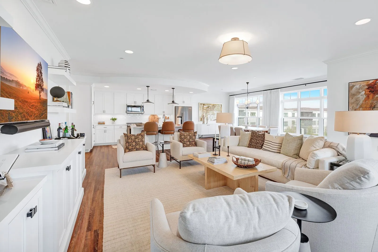Large living room in the newest apartment on the retirement community campus, featuring elegant decor, comfortable seating, and plenty of natural light.