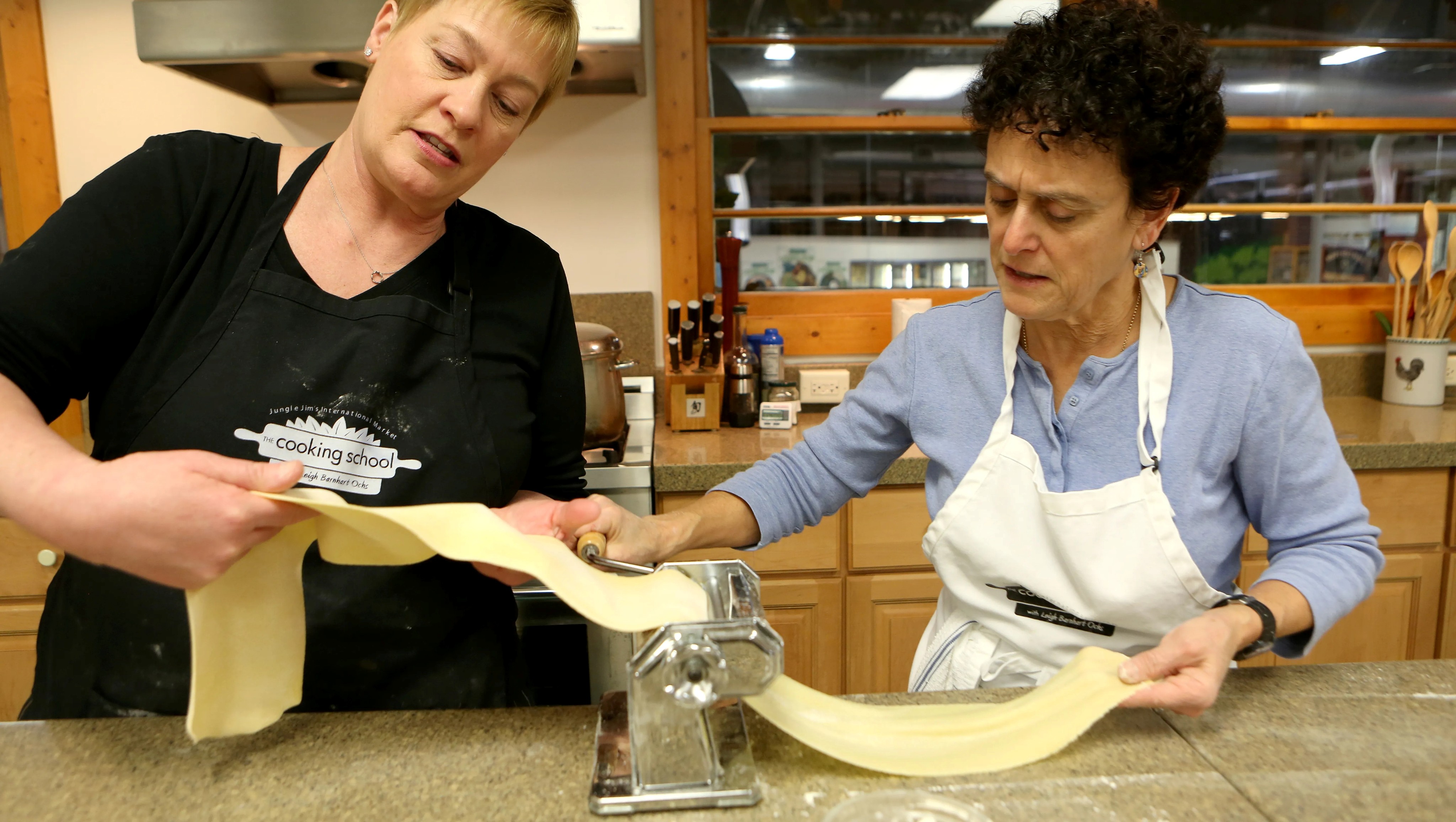Two cooks rolling pasta in The Cooking School