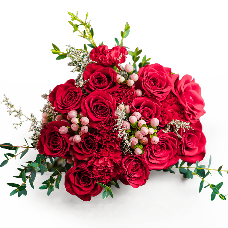Bouquet of red roses, carnations, pink berries, and green foliage on a black background.