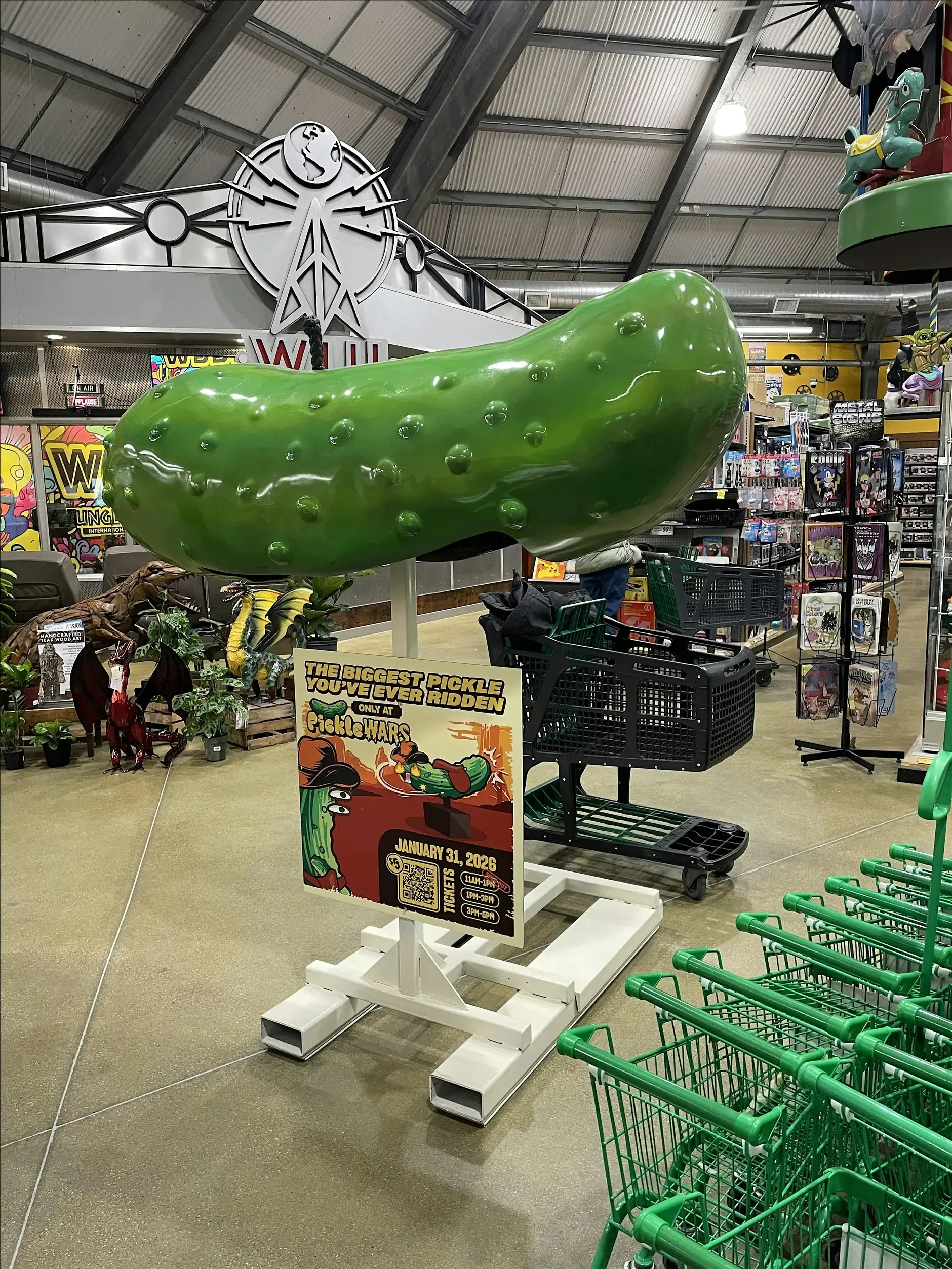 Giant pickle decoration hanging above the festival floor