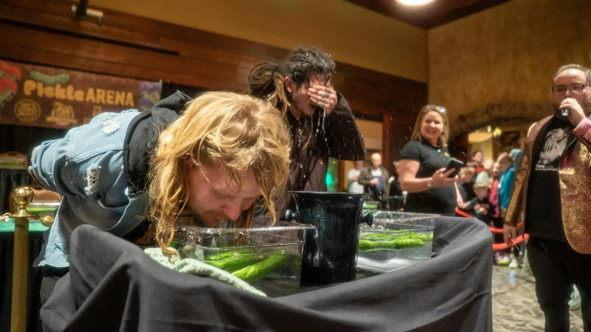 Contestant tasting a pickle during Pickle Wars