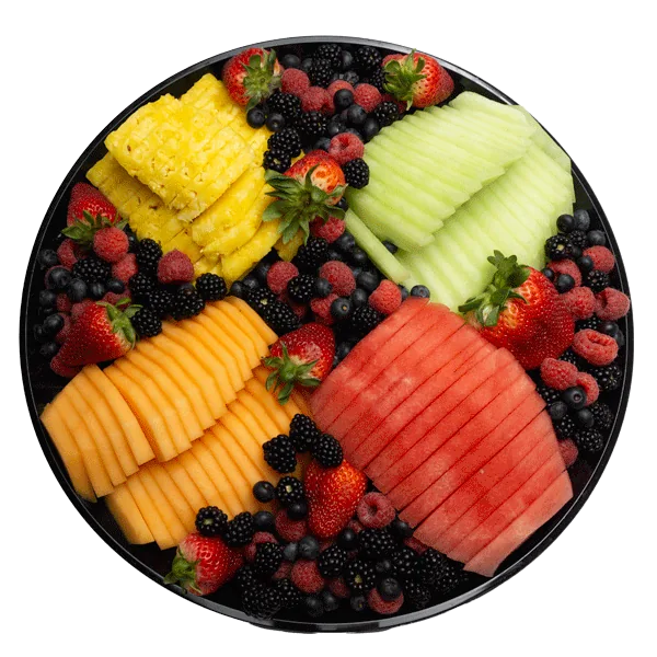 Sliced fruit and berries party tray