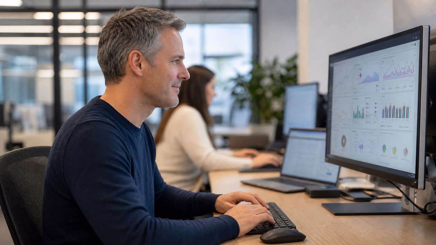 IT professional analyzing charts on computer screen 57 chars