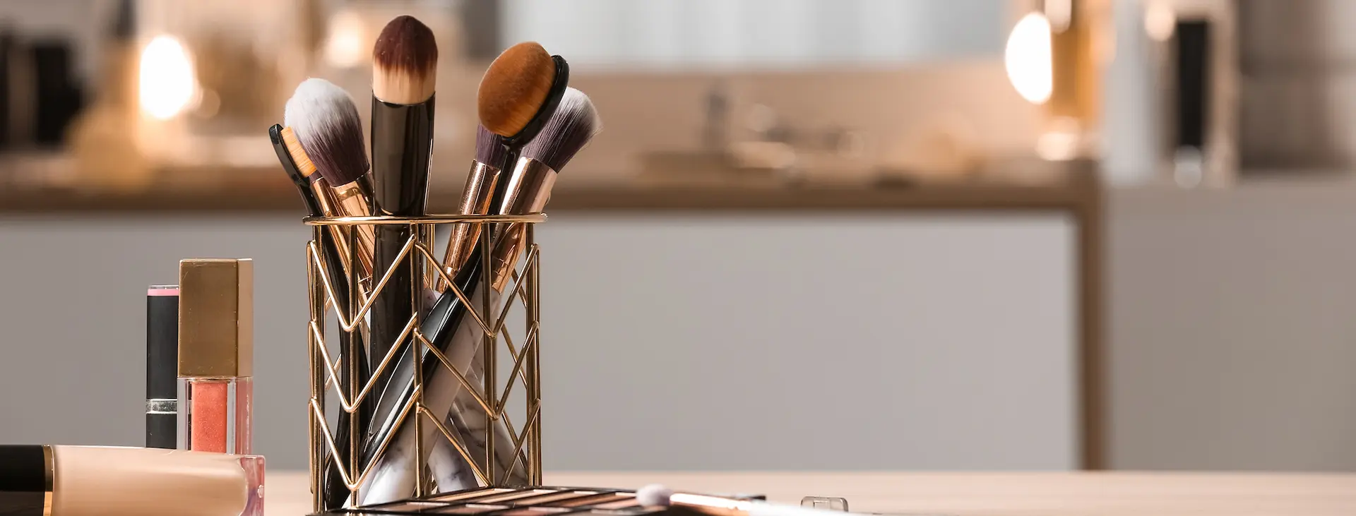 Makeup brushes and beauty products arranged on a beauty studio table