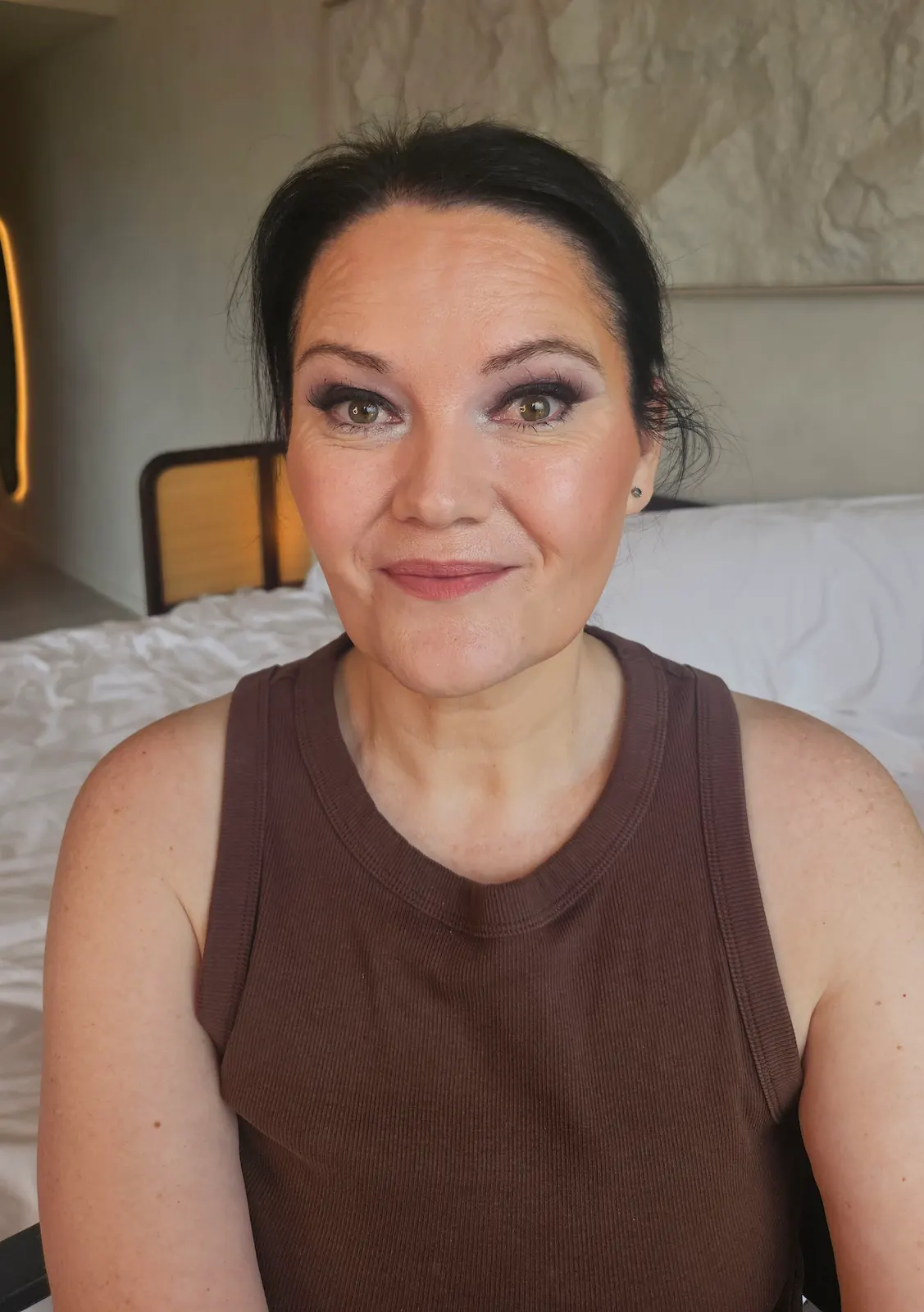 Woman with evening glam makeup and soft smoky eyes at Gold Coast hotel makeup appointment