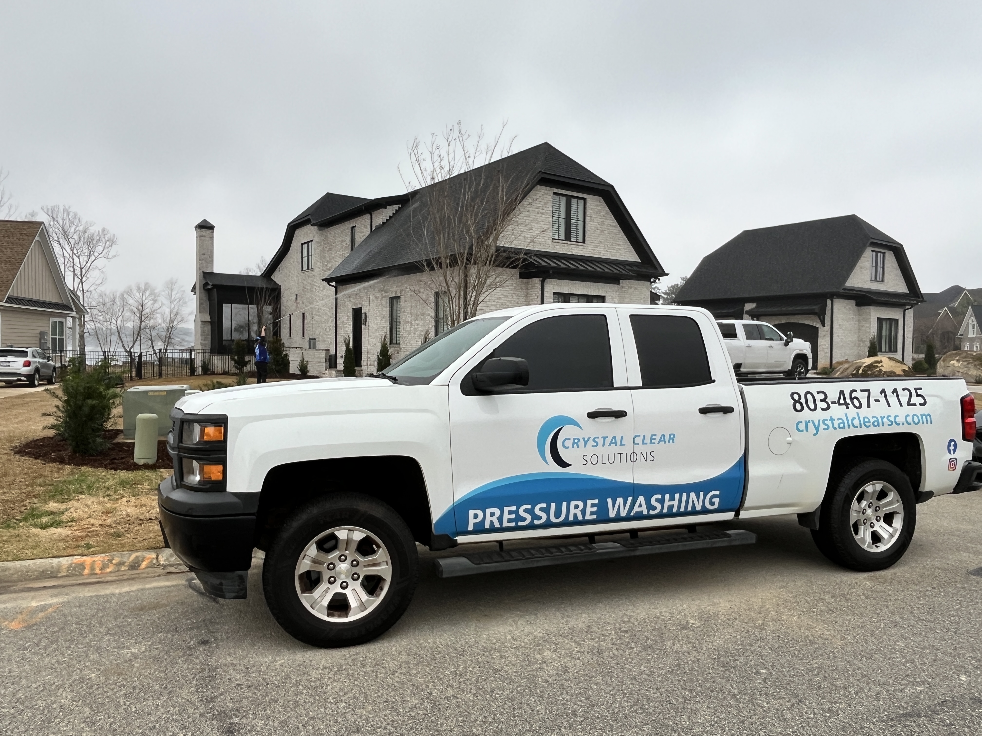 Crystal Clear Company Truck At Local Lake House For Cleaning