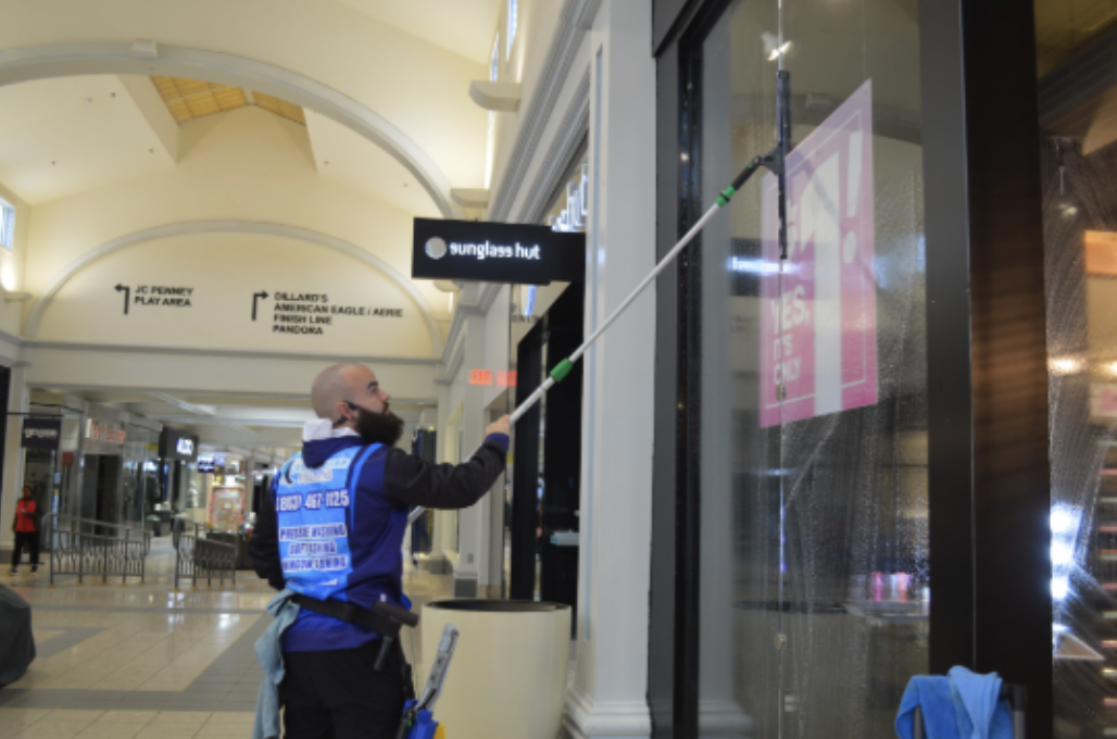 Sam cleaning a client window