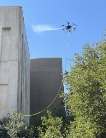 Drone power washer cleaning tall building in SC