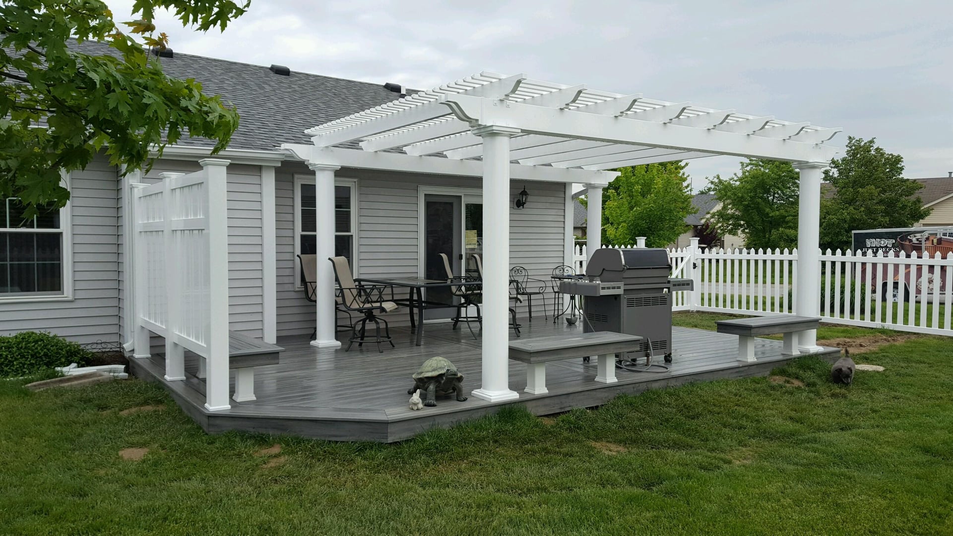 White pergola over composite deck by Knot Just Decks