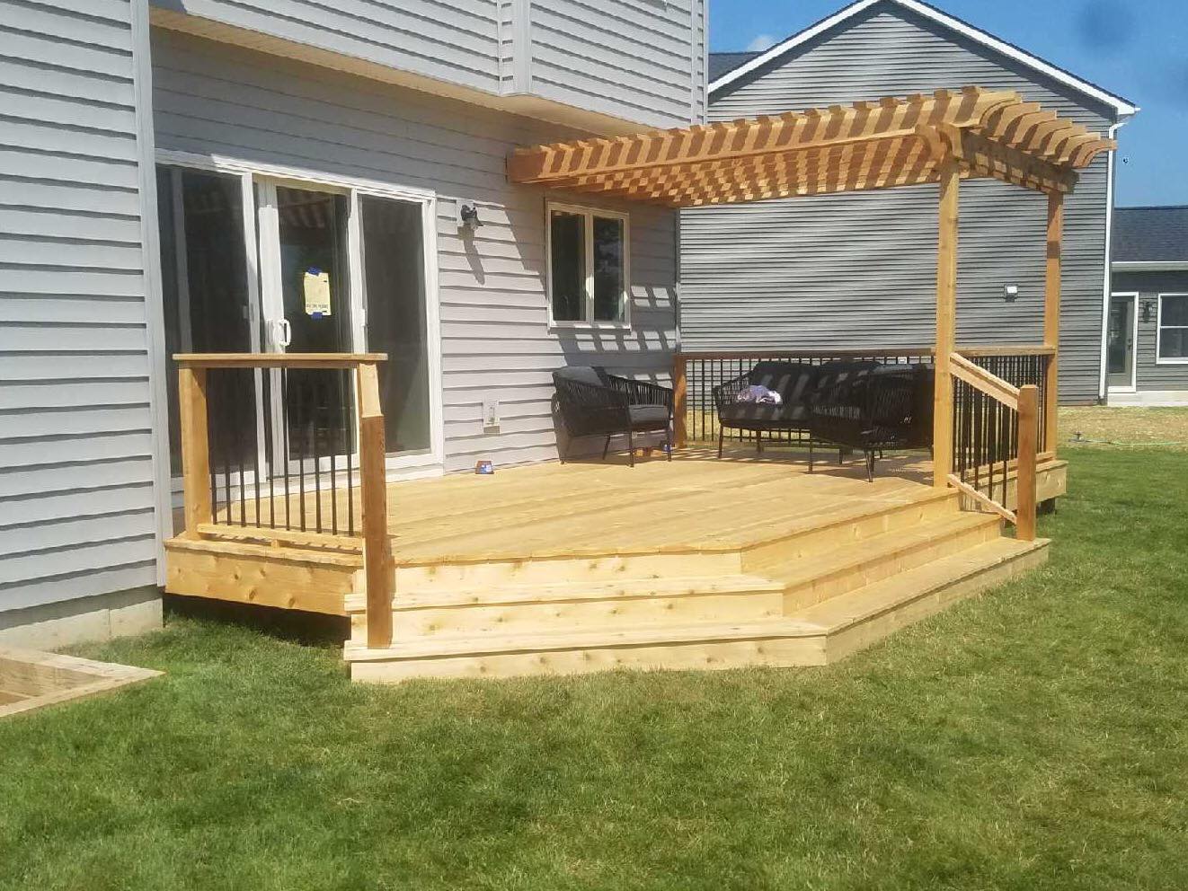 Outdoor living patio with custom pergola by Knot Just Decks
