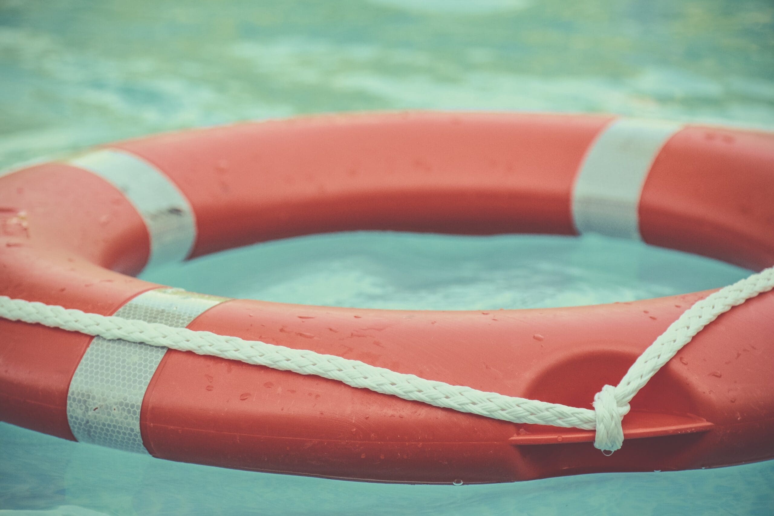 Life buoy floating on water.