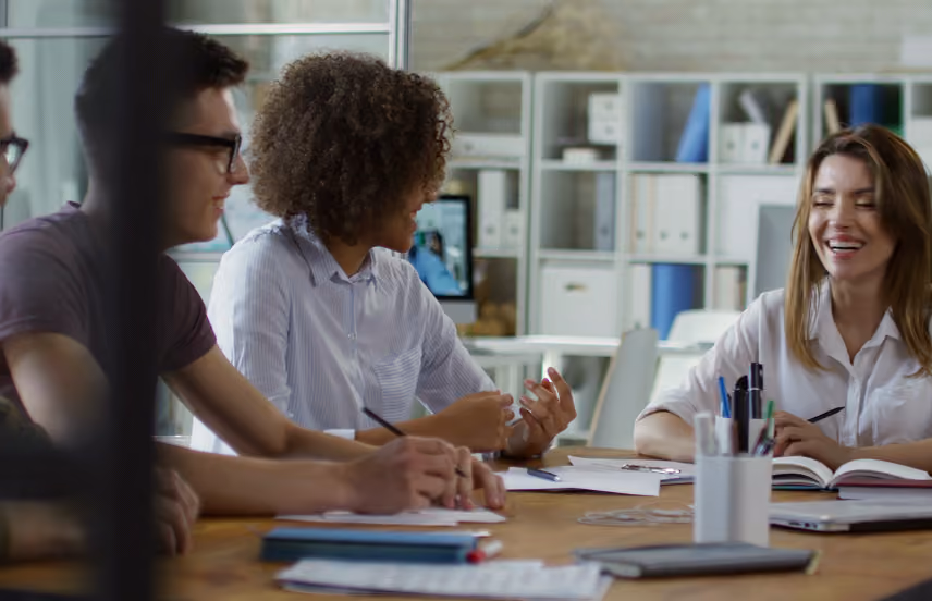 Team members collaborating during an office meeting.